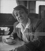 Agnes Smedley, sitting in coffee shop